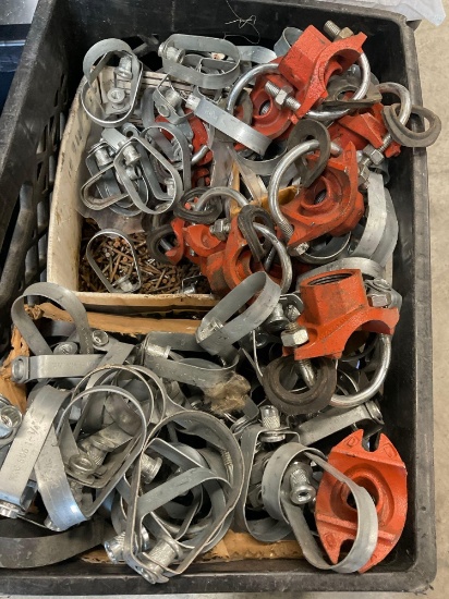 Assorted pipe fittings, 2" swivel loop hangers and nails. Over 100 pieces