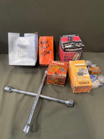 Assorted vehicle parts & wrench. 10 pieces