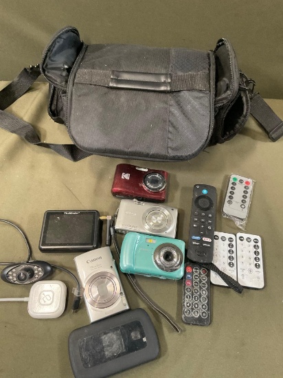 Untested, no cords. Assorted cameras, remote controls, bag, etc. 13 pieces
