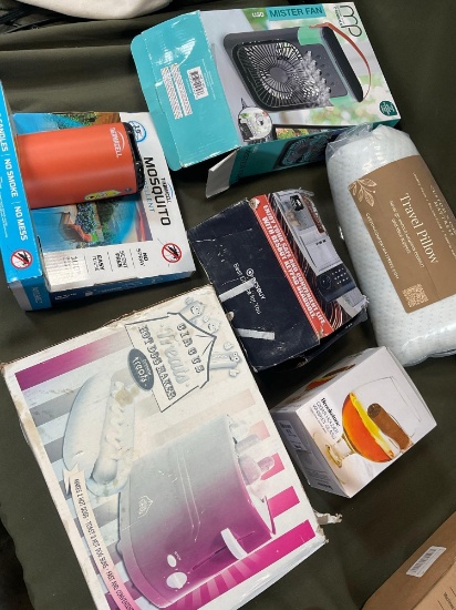 Assorted items.Mister fan, travel pillow,whiskey glass, hot dog maker, key pad, mosquito repellent