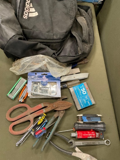 Adidas backpack and assorted tools. 20 pieces