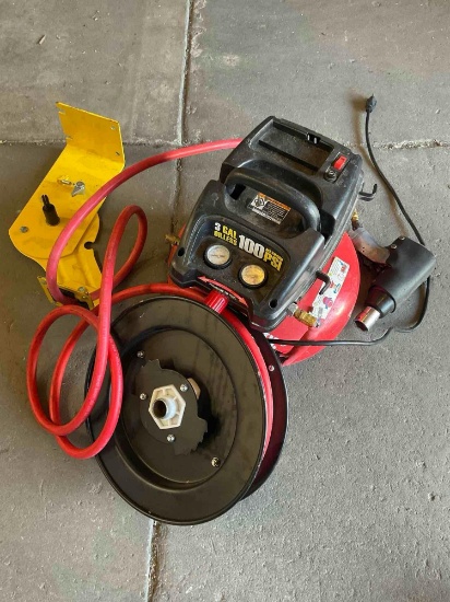 Central Pneumatic 3 gal oiless , 734 air wrench, hose reel & wall attachment, turned on, untested