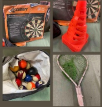 Dart board, billiard pool balls, orange cones, fishing net.
