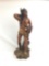 Resin statue featuring native American Indian with bow and arrow