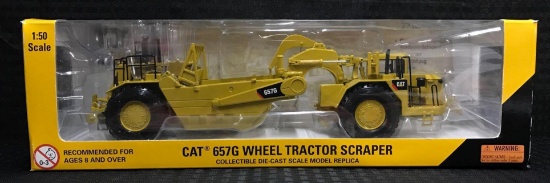 Caterpillar CAT 657G Wheel Tractor Scraper in Box