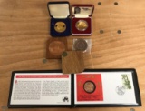 Group of five brass and bronze commemorative coin?s