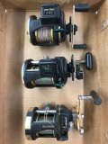 Box Lot of three fishing reels With line counters