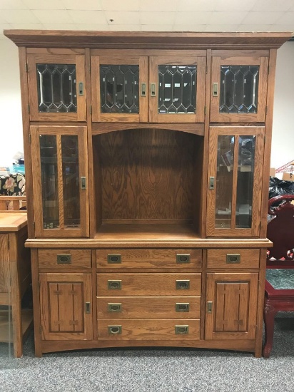 Two piece oak cabinet with leaded glass