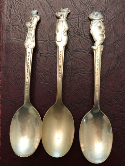 Lot of three vintage character spoons