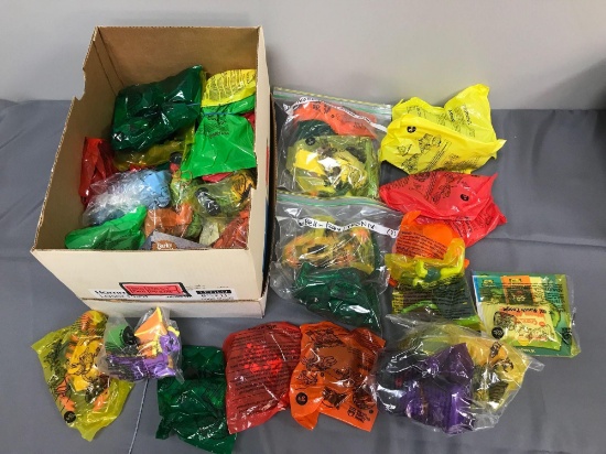 Group of Taco Bell kids' meal toy premiums in original packaging