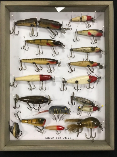 Case with 17 vintage creek chub Lures