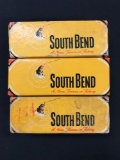 Three vintage South Bend casting spoons with boxes