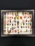 Case with 66 fly fishing popper lures