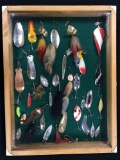 Case of vintage spoon and buck tail Lures