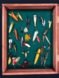 Case of various antique fishing Lures