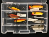 Case with a vintage wooden lures