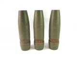Group of three US military artillery shells