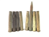 Group of eight vintage US Army artillery shells with clips