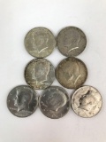 Group of seven Kennedy half dollars
