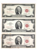 Group of three red seal two dollar notes