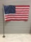 American flag on the pole with vintage flag stand