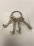 Group of 4 vintage keys on a ring