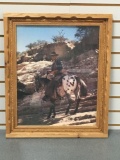 Portrait of John Wayne on a horse in wooden frame
