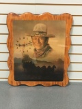 Wooden portrait of John Wayne with a clock