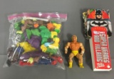 Group of DC comics superheroes and villains family field guides, Hulk Hogan doll, bag of mash them