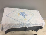 White baby blanket with duck design