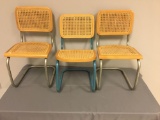 Group of three toddler chairs with woven seats