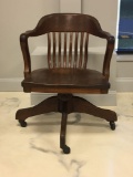 Vintage wooden rolling office chair