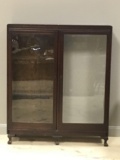 Vintage wood cabinet with glass doors