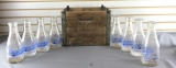 Vintage group of 8 dairy bottles and wood crate