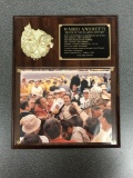 Signed photo of Mario Andretti In a Plaque
