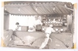 Antique Black and White Photograph of Men Playing a Carnival Target Shooting Game