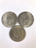 Group of three Mexican silver pesos