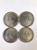 Group of 4 foreign silver coins