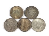 Group of five silver peace dollars