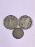 Group of three silver half dollars and silver quarter