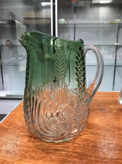 Antique green to clear pressed glass pitcher