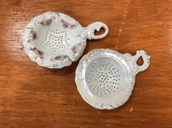 Group of two antique porcelain tea strainers