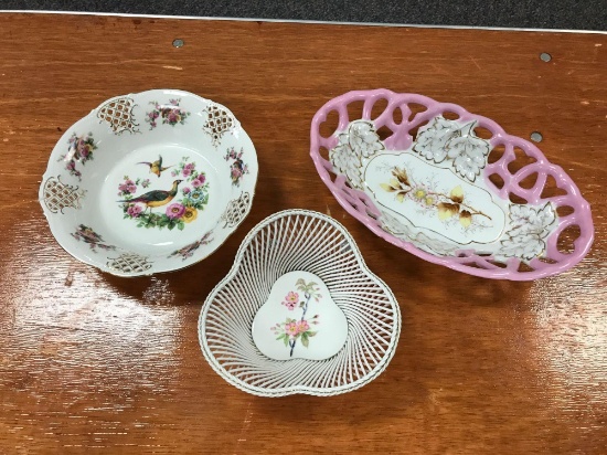 Group of three porcelain bowls with floral designs