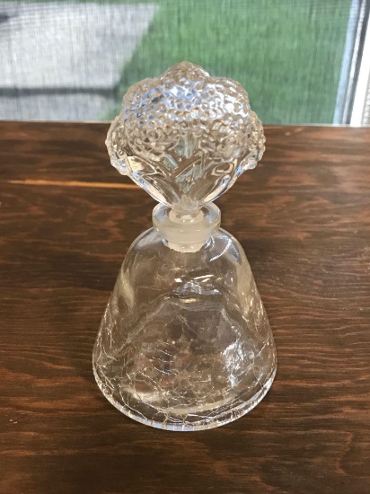 Perfume bottle with cracked glass and poppyseed floral design