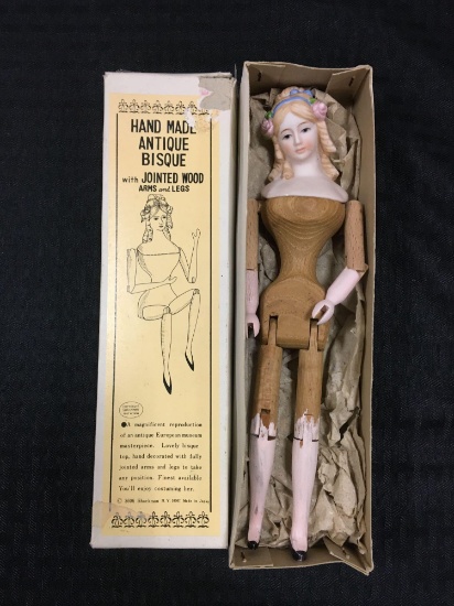 Antique Bisque Doll with jointed wood arms and legs