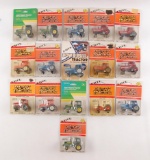 Group of 16 ERTL 1/64 Scale Toy Tractors in Original Packaging