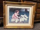 Framed Print of a Young Girl with Bunnies