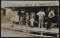 Real Photo Postcard of Grocery Store Front Featuring Children with Catfish