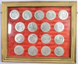 (17) Olympic Games Collector Tokens in Wall haning Display.