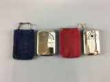 Group of 2 vintage lighters with pouches